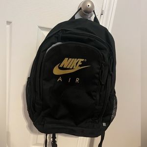 Nike backpack like new. Black with gold lettering